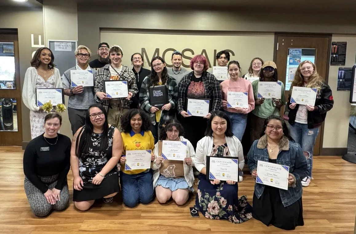 MSP Cohort 2026 posing with certificates in front of the MOSAIC sign